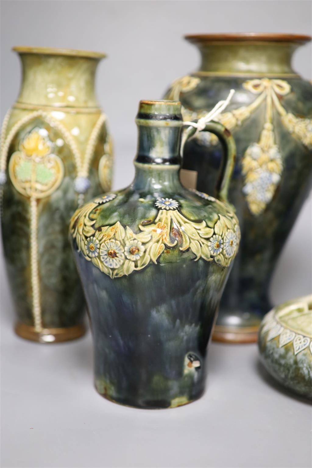 A pair of Royal Doulton vases, a similar larger vase and a small flagon
